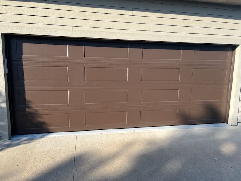 Project Sleek Brown Paneled Garage Door Installation image